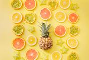 Sliced Fruits Composition On Yellow Background