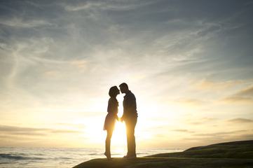 Couple Kissing at Sunset