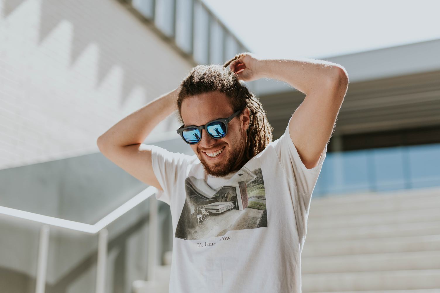 A Guy with Beard and Sunglasses Smiling