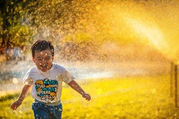 Happy Boy Running, Water Spray