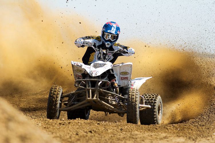Quad Rider Driving in the Motocross Race