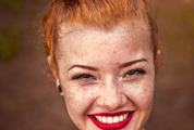 Closeup Portrait of Redhead Girl with Brown Eyes and Freckles, Natural Beauty