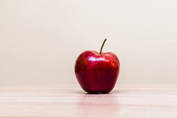 Red Ripe Apple on the Table