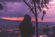 Sunset at the Mountain View with a Man Wearing Hood