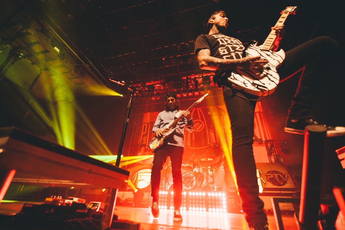 Free Photo Rock Guitarists Playing Guitar at a Concert
