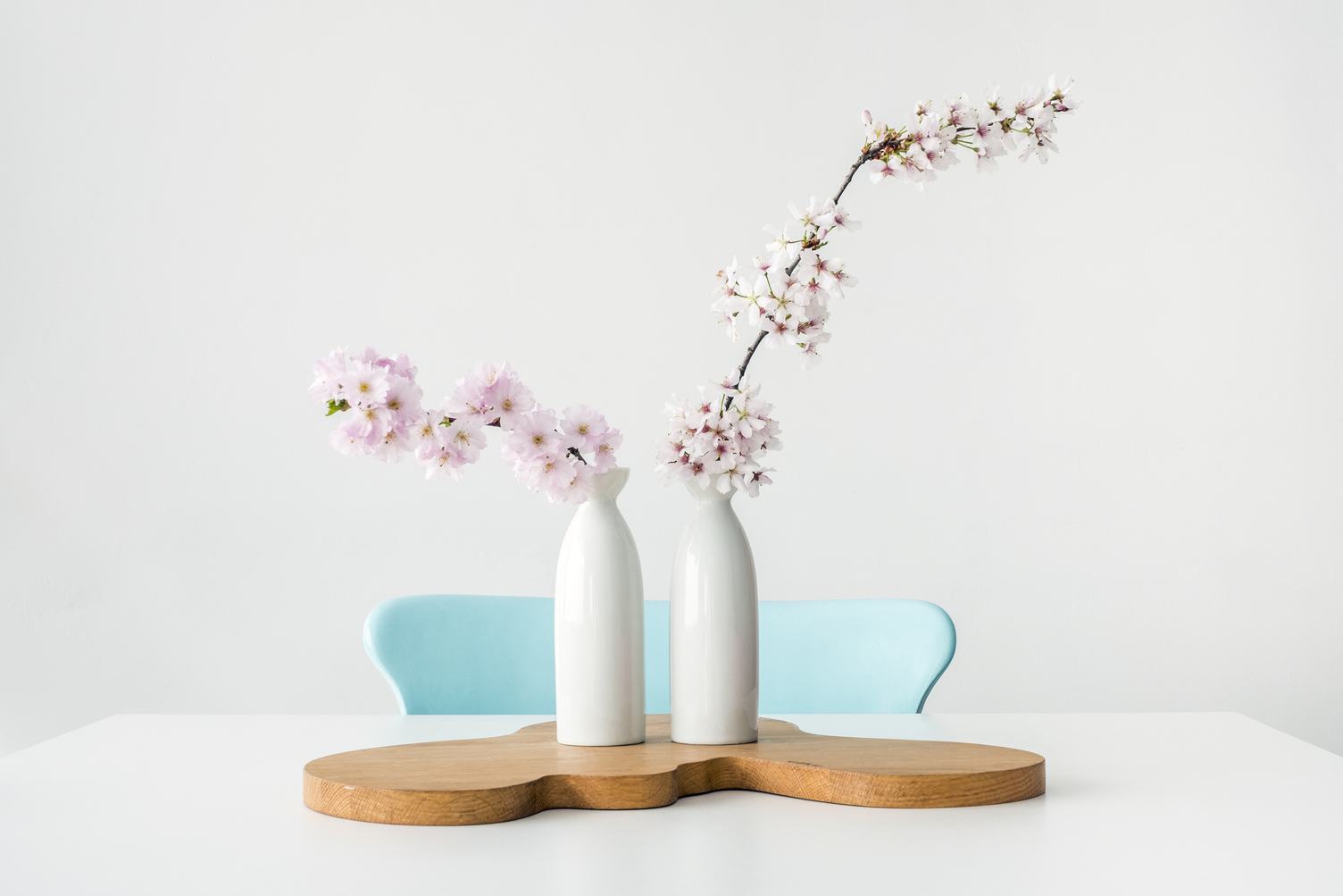 Pink Blossoming Flowers of the Fruit Tree on White Table