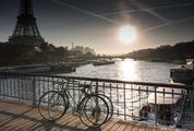 Two Bicycles Standing on the Bridge next to the Eiffel Tower in Paris, France