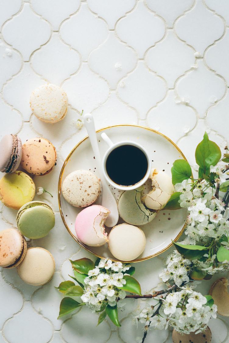 Coffee, Macaroons and Blooming White Branch on a White Table