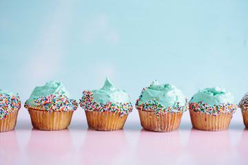 Colorful Cupcakes on a Turquoise Background