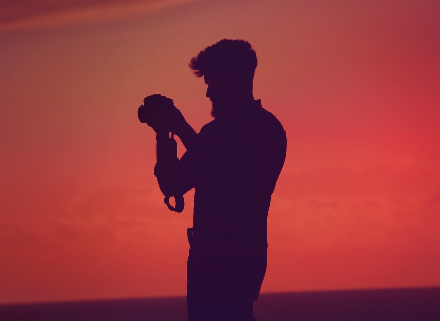Bearded Man Silhouette Holding Camera