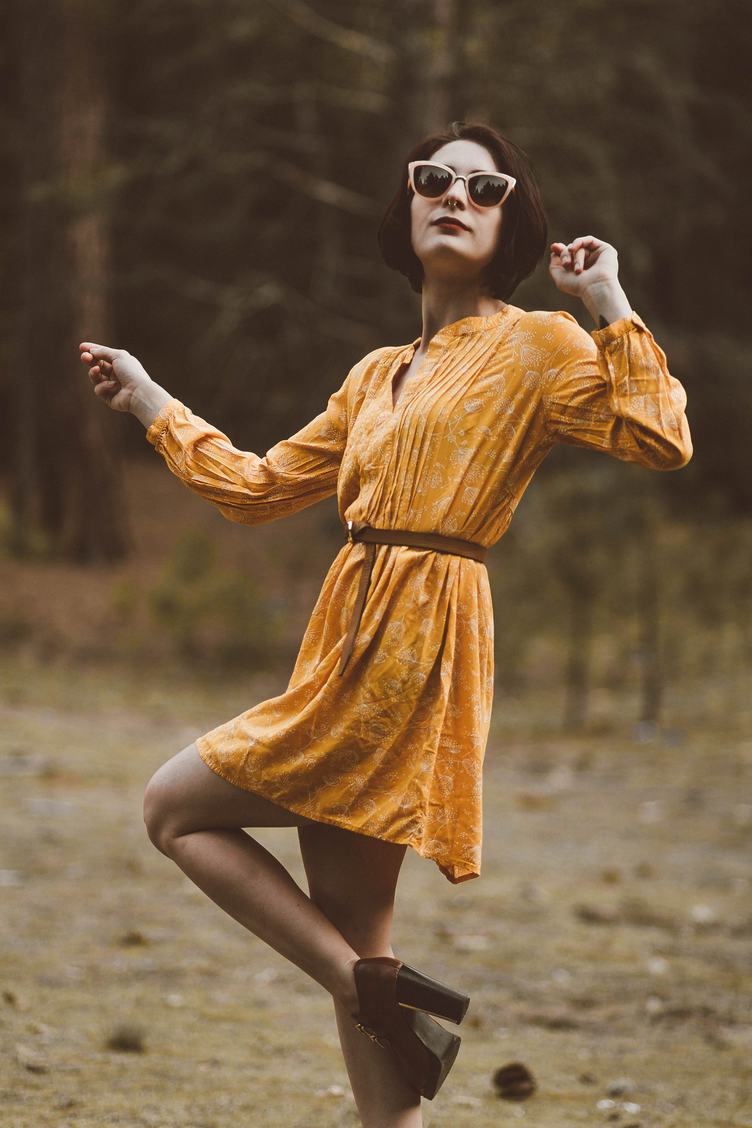 Woman in Yellow Retro Dress and High Heels Shoes Dancing in the Forest