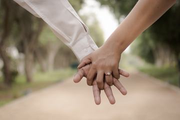 Close-Up Holding Hands with Wedding Ring