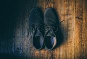 Black Velor Shoes on a Wooden Floor