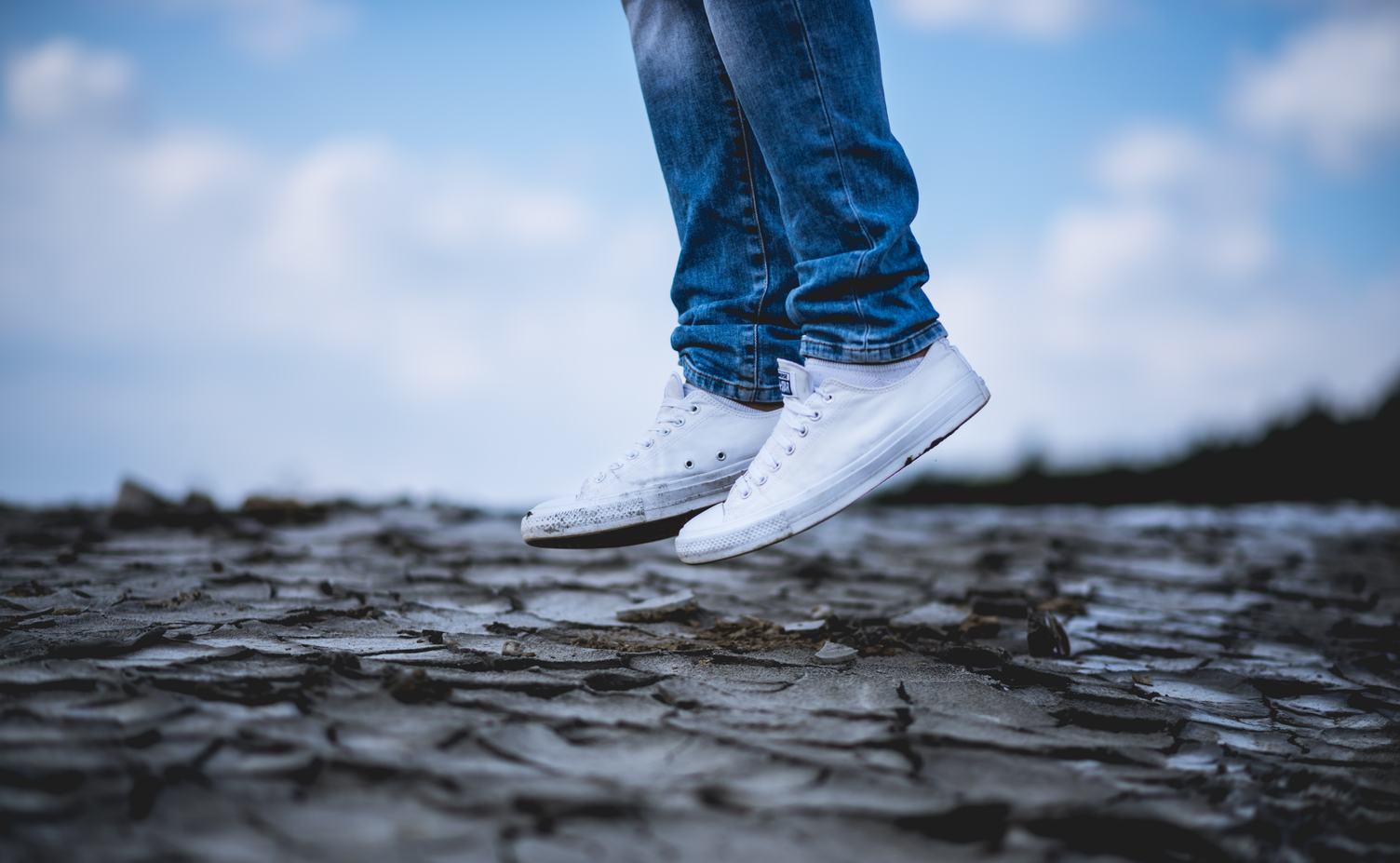 Person in White Sneakers Jumping