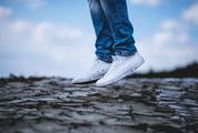 Person in White Sneakers Jumping