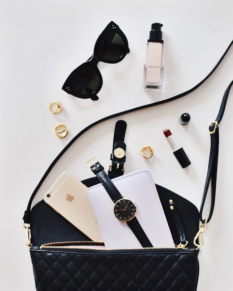 Female Handbag Content Phone, Sunglasses, Watch, on White Background
