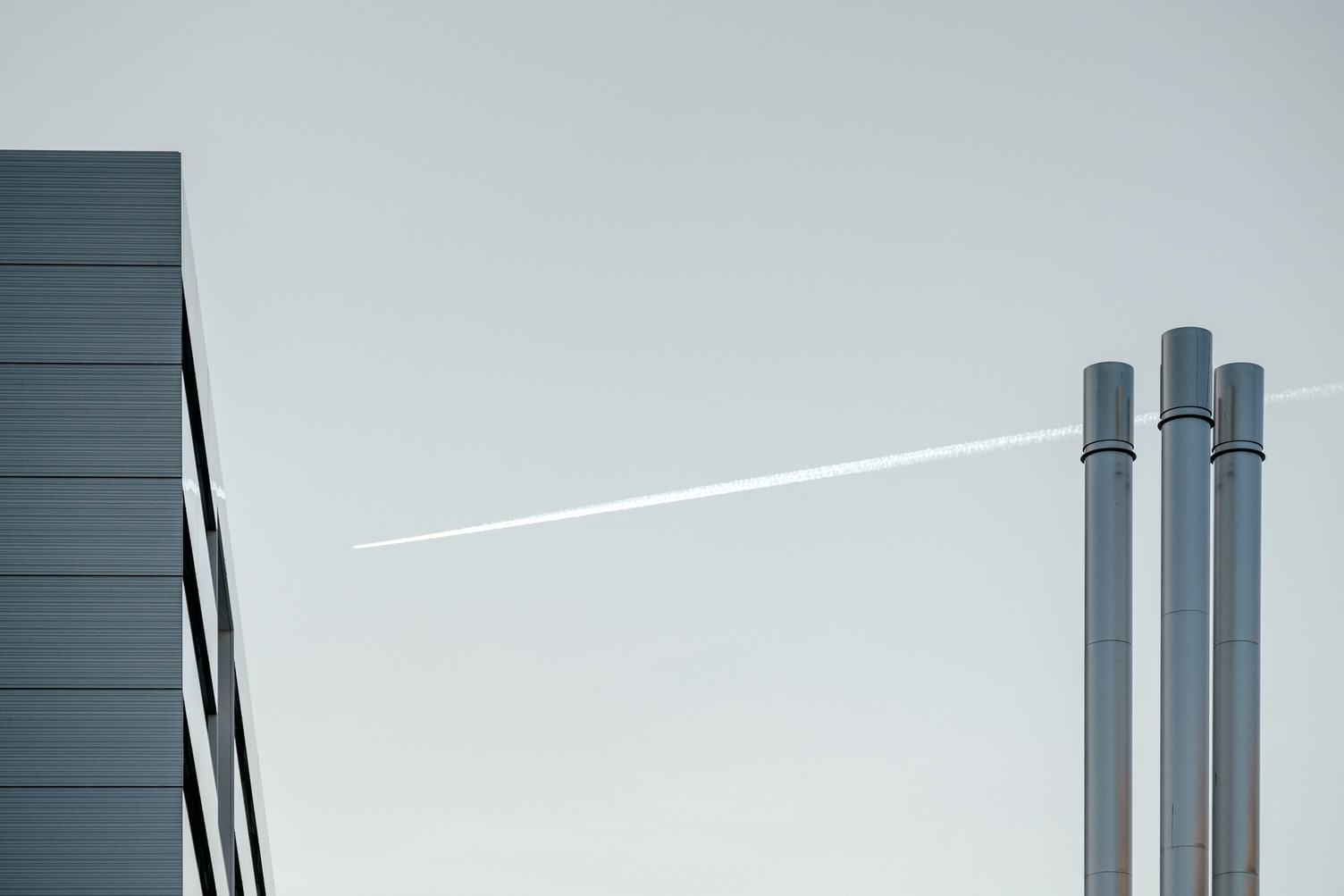 Building and Chimneys against Gray Sky