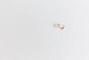 Wedding and Engagement Gold Rings against White Background