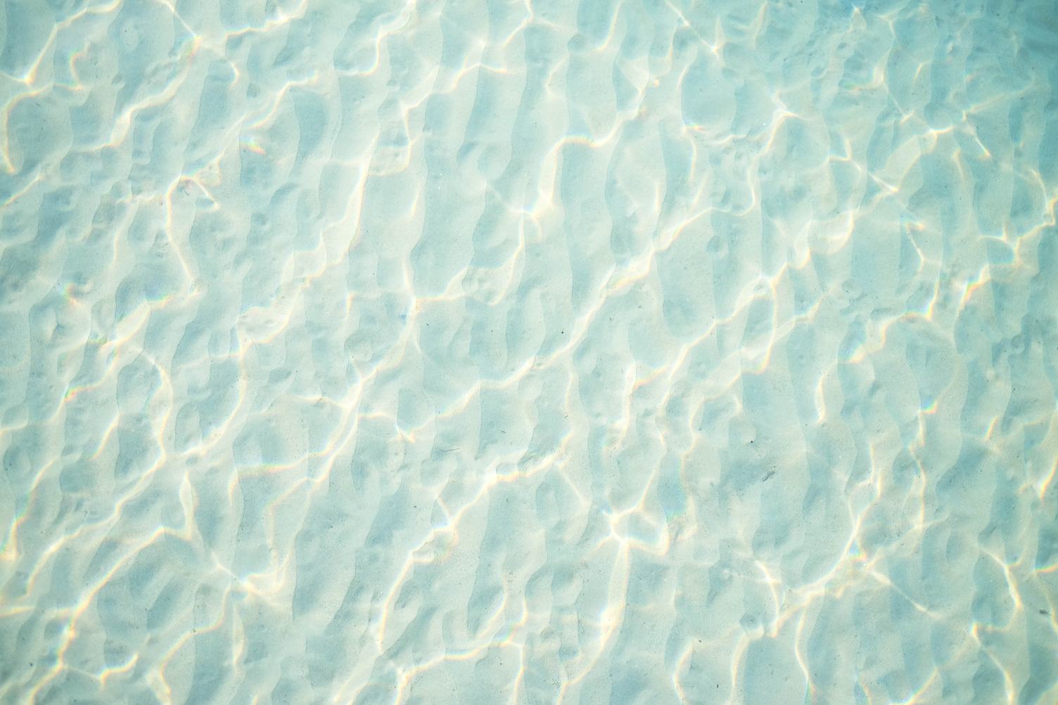 Light Blue Rippled Sand under Water Texture