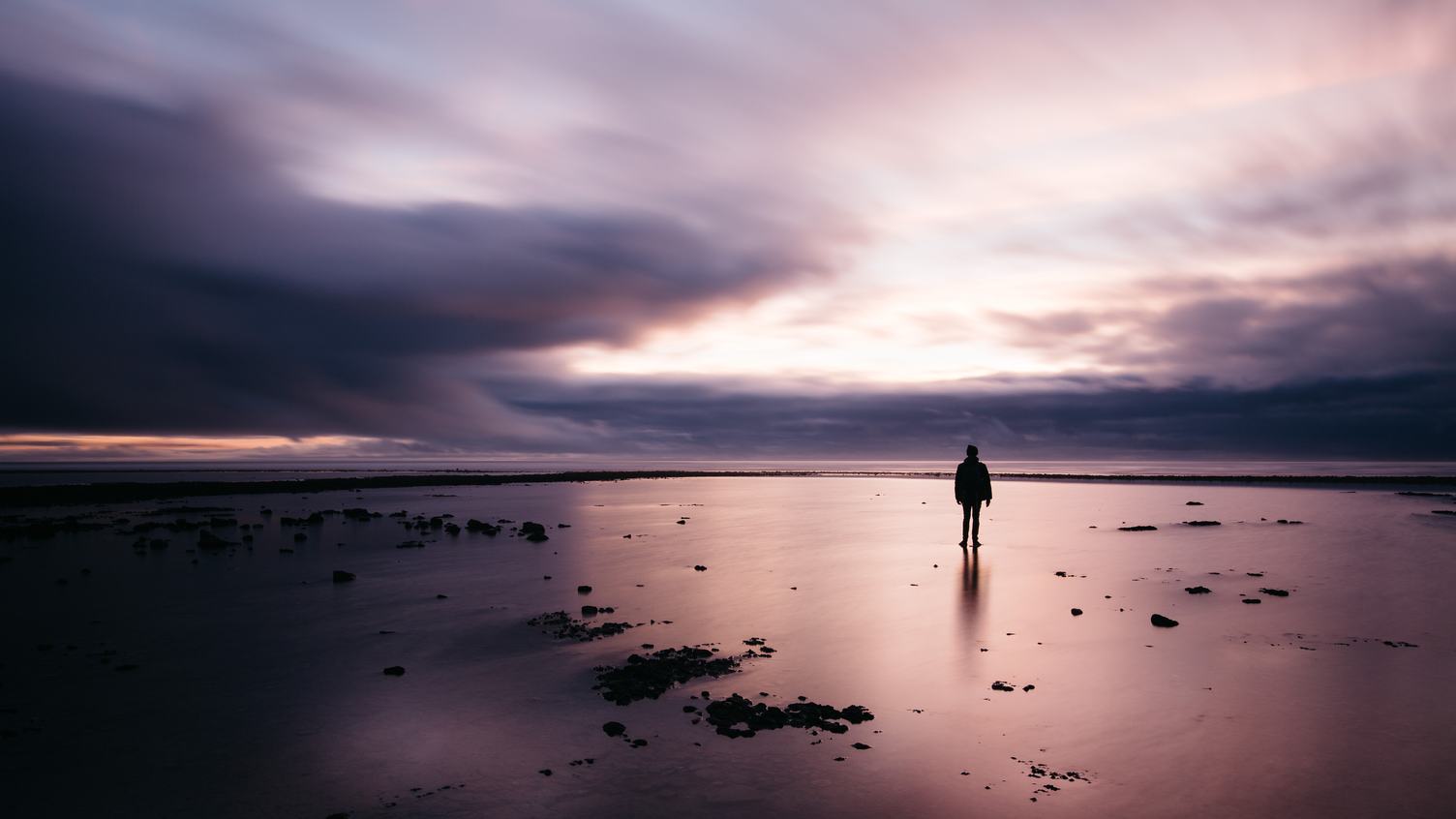 Stunning Long Exposure Sunset Shot Man on the Beach