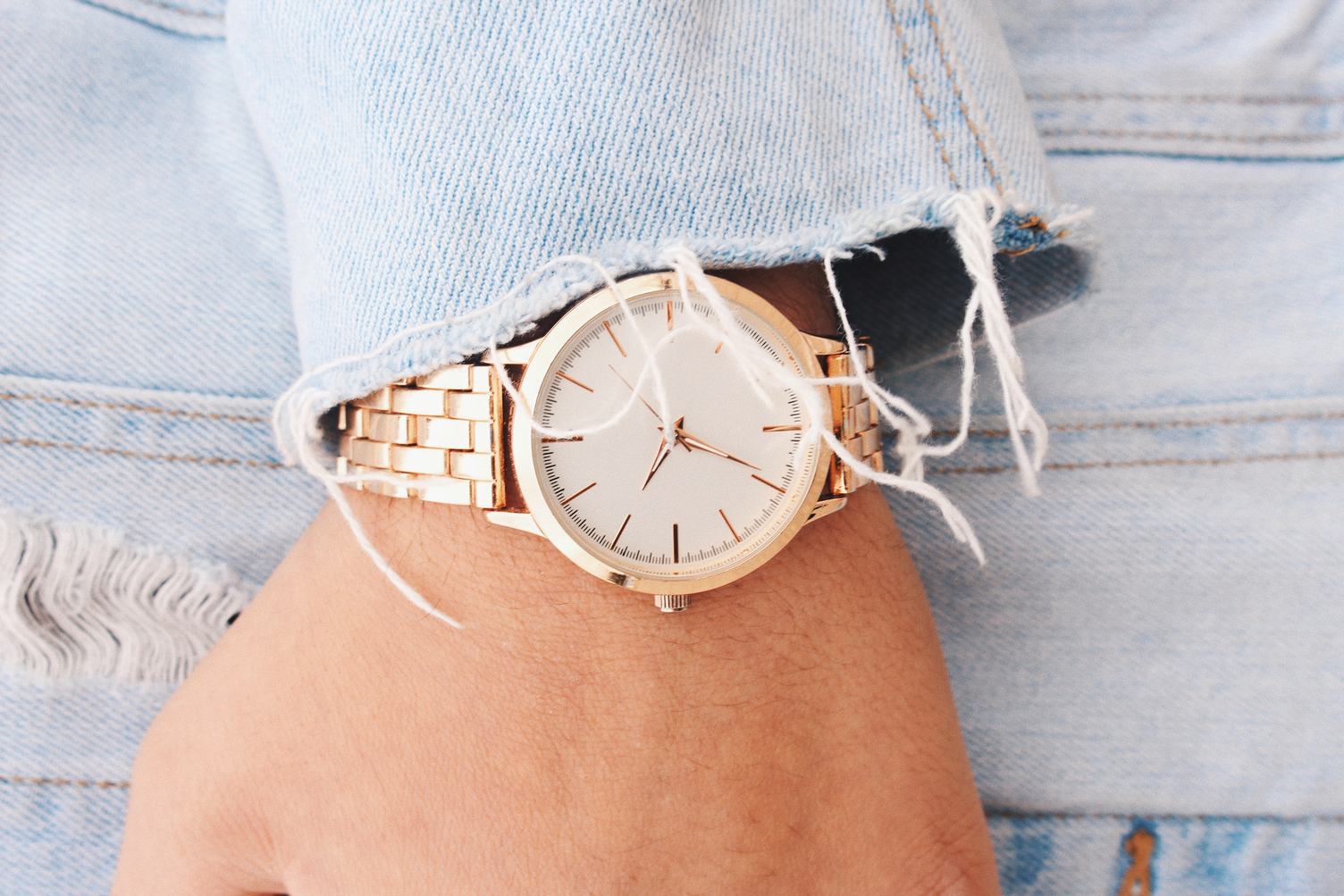 Closeup Fashion Details, White and Golden Watch and Jeans