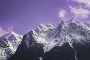 Mountain Peak in Snow against Violet Sky