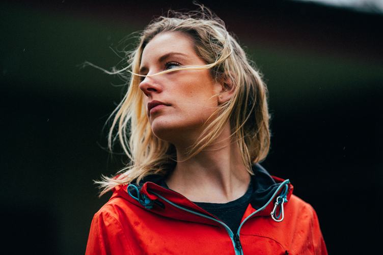 Outdoor Portrait of a Young Lady in a Sports Orange Jacket