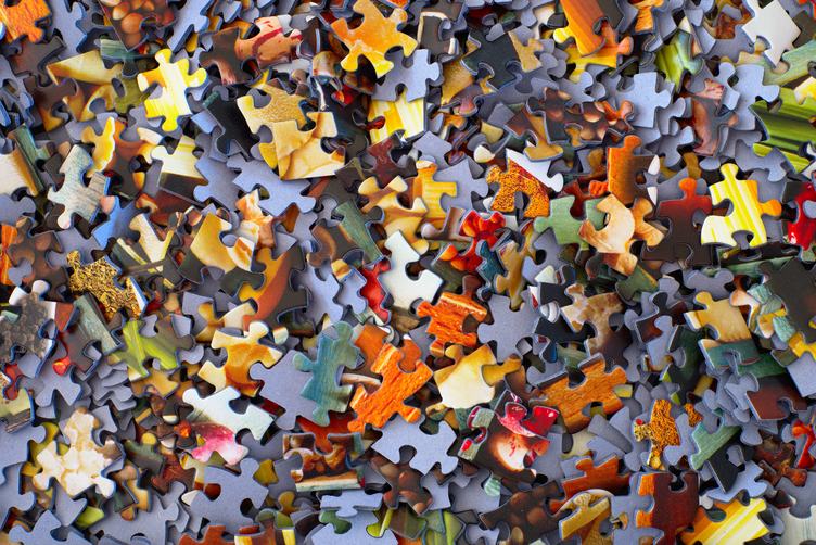 Randomly Scattered Colorful Puzzle Pieces Background
