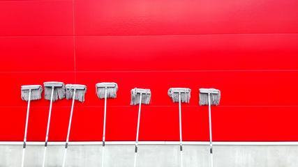 Red Clean Tiled Wall with Seven Mops