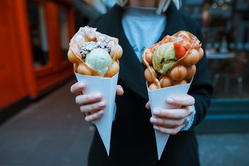 Woman Standing with Delicious Ice Creams in her Hands