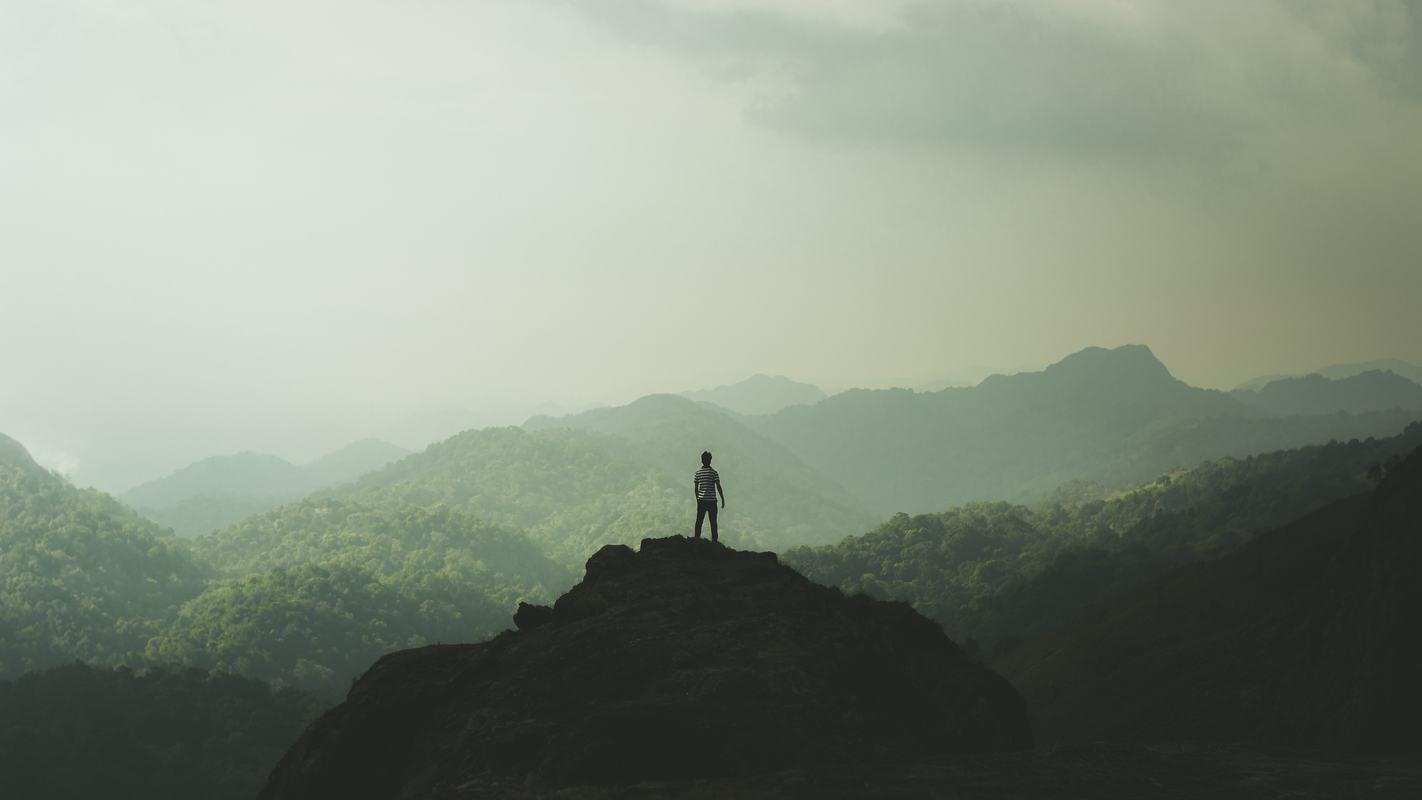 mountains-man-standing-peak.jpg