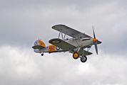 Gray Biplane Flying