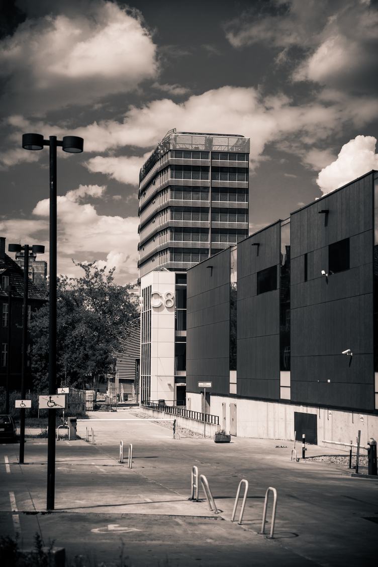 Black & White Photo of Buildings and Parking