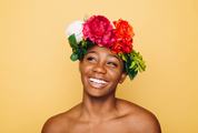 Smiling Woman with Flower Werth and Bare Shoulders