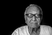 Black & White Portrait of Old Man Wearing Glasses