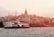 Tourist Ship in Istanbul View on Galata Bridge and Tower