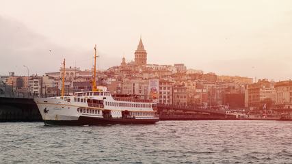 Tourist Ship in Istanbul View on Galata Bridge and Tower