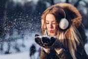 Young Woman Blowing Snow, Magic Snowfall Effect