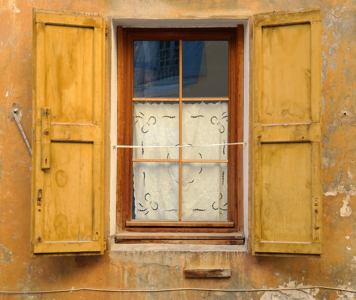 Old Window with Yellow Shutters