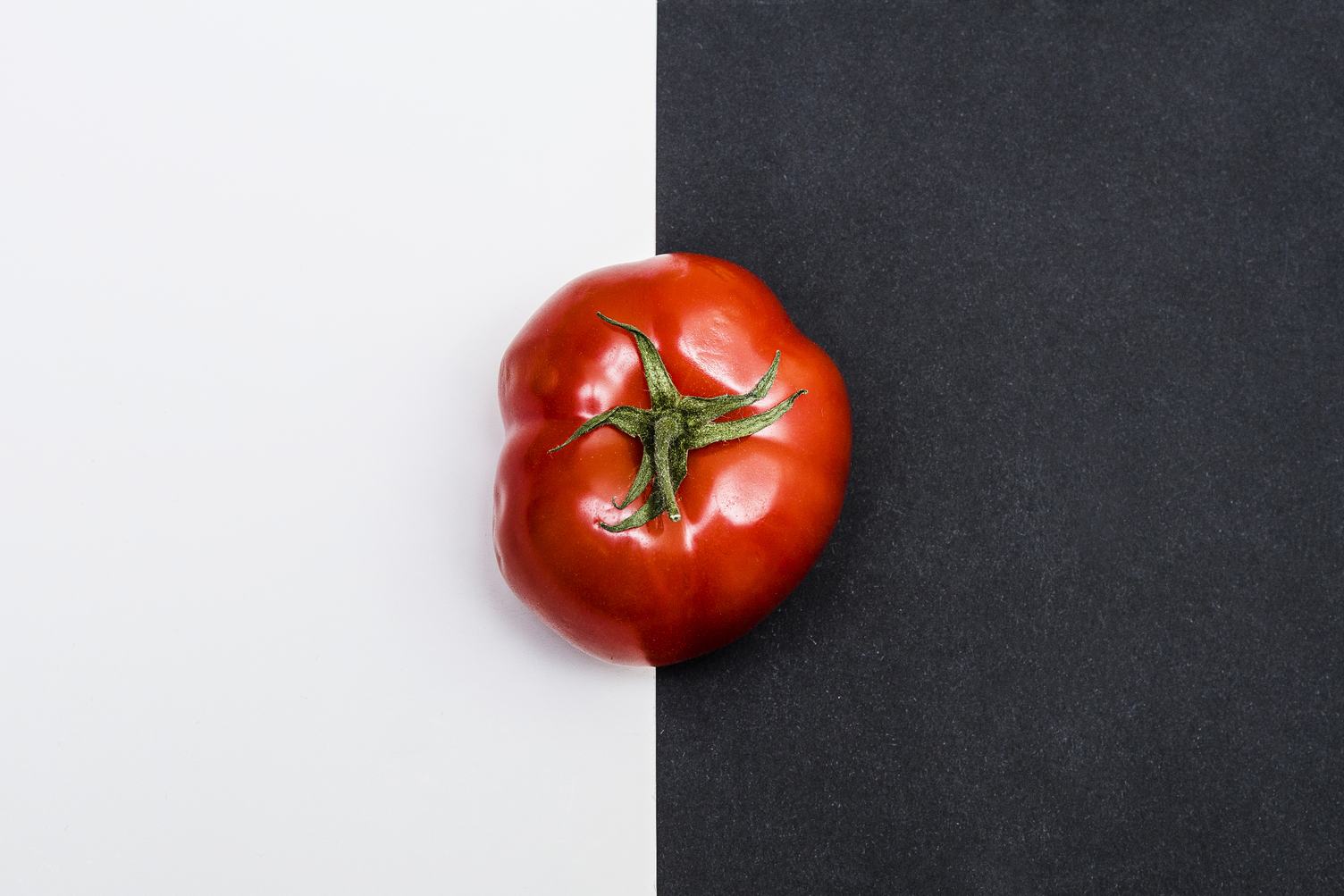 Ripe Tomato on Black and White Background Top View