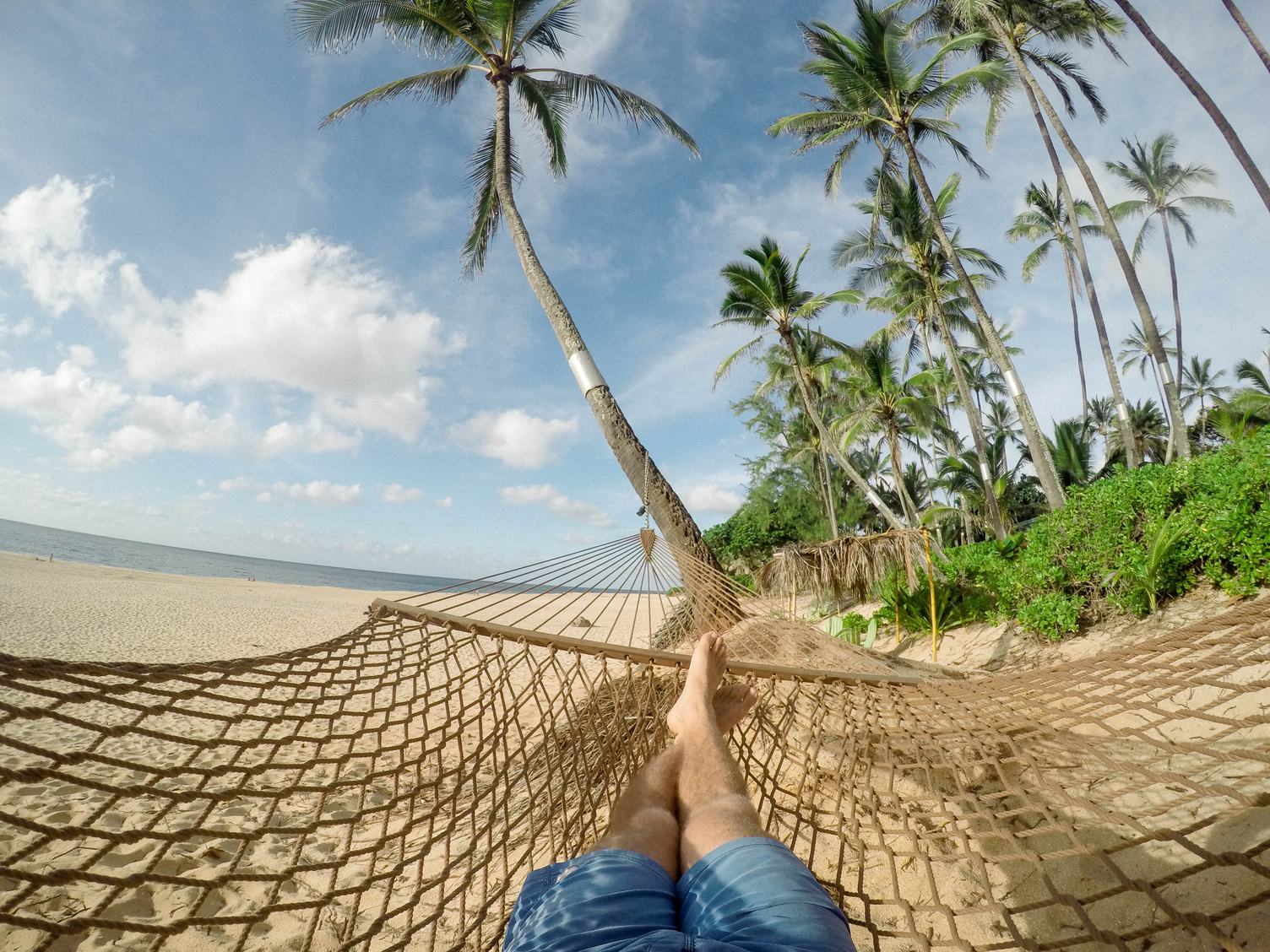 Lazy Time Man in a Hammock on the Beach