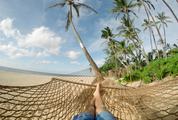 Lazy Time Man in a Hammock on the Beach