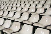Numbered Gray Seats in a Stadium