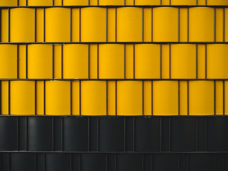 Metal Fence with Yellow and Black Elements