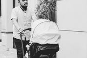 Father Walking with Baby in Stroller