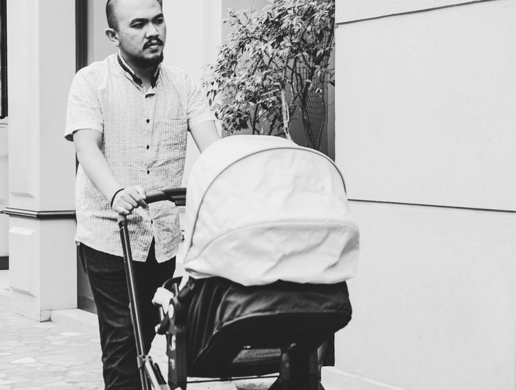 Father Walking with Baby in Stroller