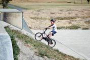 Little Boy Ride His Bike Uphill