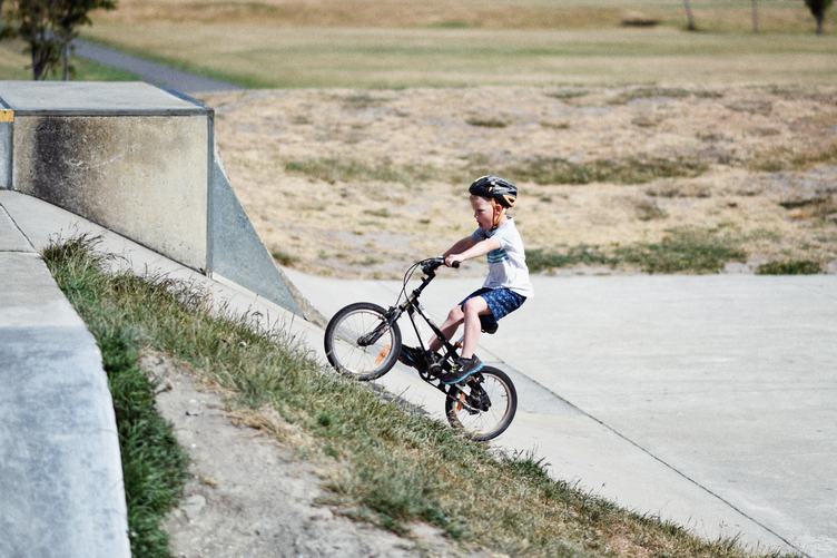 Little Boy Ride His Bike Uphill