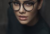 Portrait of Young Woman Wearing Retro Black Glasses
