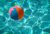 Colorful Beach Ball Floating on Water